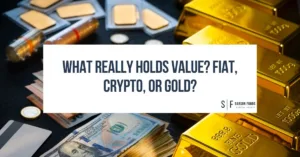 Stacks of gold bars, U.S. dollar bills, coins, and credit cards arranged side by side